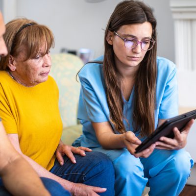 aged care worker talking to patient